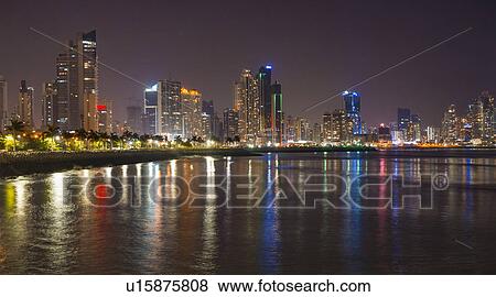 Stock Photo - Illuminated cityscape at night. Fotosearch