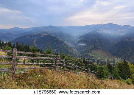 Stock Image - Landscape with mountains and forests. Fotosearch