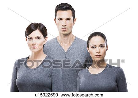 Man and two women wearing grey tops View Large Photo Image Stock Image - Man and two women wearing grey tops. Fotosearch
