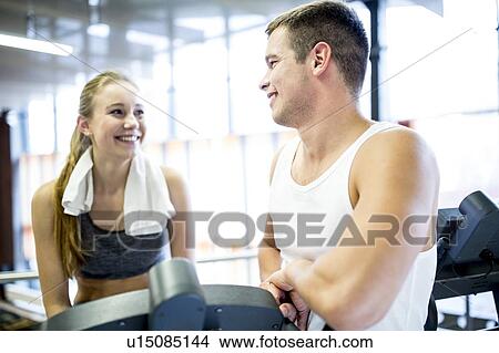 Man and woman in gym View Large Photo Image Picture - Man and woman in gym. Fotosearch