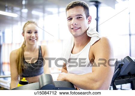Man and woman in gym, portrait View Large Photo Image Stock Image - Man and woman in gym, portrait. Fotosearch