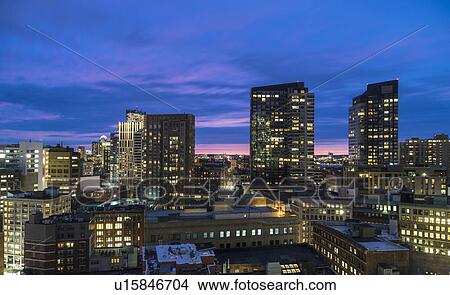 Modern downtown district at dusk View Large Photo Image Picture - Modern downtown district at dusk. Fotosearch