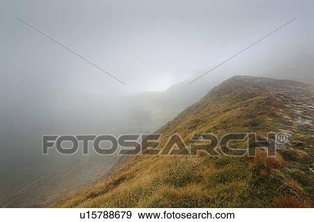 Stock Photo - Mountains in fog. Fotosearch