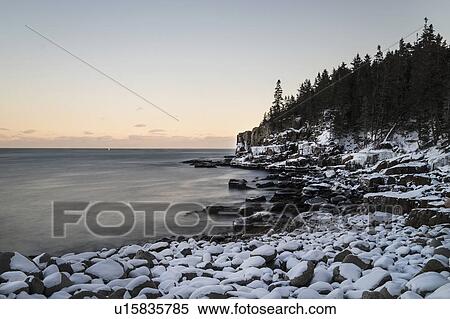Stock Photography - Otter Cliffs in Acadia National Park in winter. Fotosearch