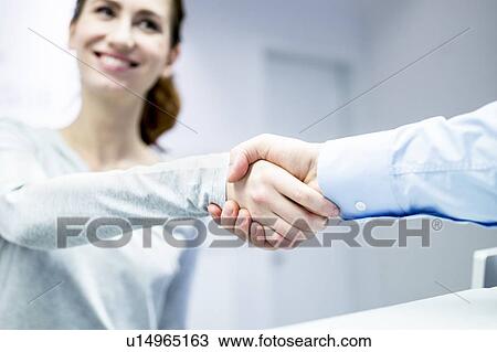 Patient and dentist shaking hands View Large Photo Image Stock Image - Patient and dentist shaking hands. Fotosearch