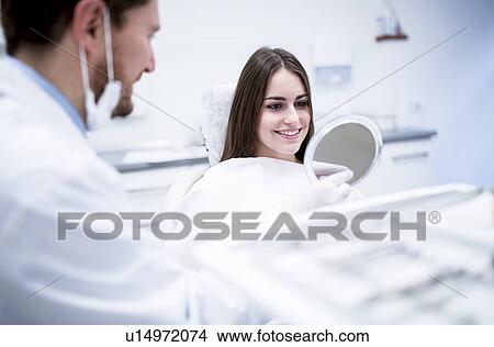 Patient looking in mirror View Large Photo Image Picture - Patient looking in mirror. Fotosearch