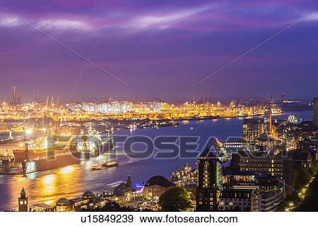 Stock Photo - Port of Hamburg at sunset Hamburg, Germany. Fotosearch