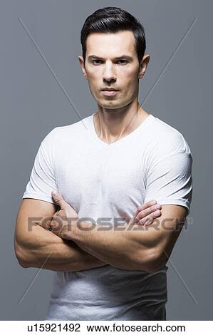 Portrait of man in white t-shirt View Large Photo Image Stock Image - Portrait of man in white t-shirt. Fotosearch
