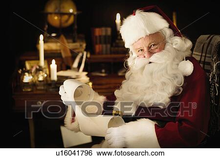 Portrait of Santa Claus reading child's letter View Large Photo Image Stock Photograph - Portrait of Santa Claus reading child's letter. Fotosearch