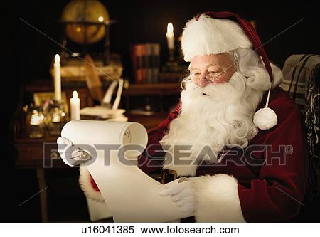 Stock Photography - Portrait of Santa Claus reading child's letter. Fotosearch
