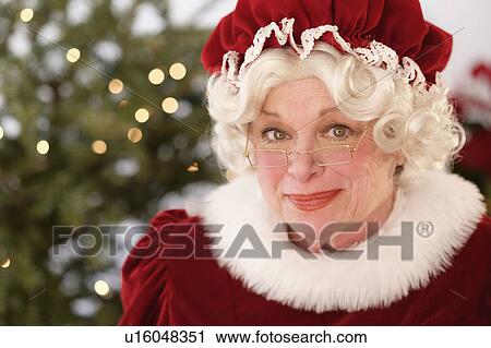 Portrait of smiling Mrs. Claus View Large Photo Image Stock Image - Portrait of smiling Mrs. Claus. Fotosearch