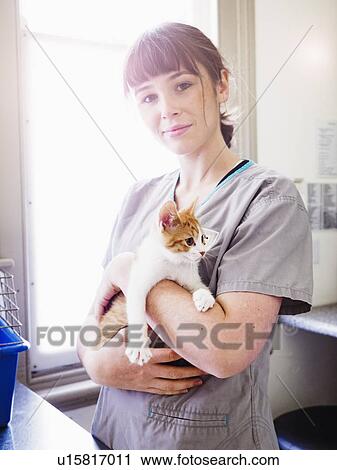Portrait of vet with kitten View Large Photo Image Stock Image - Portrait of vet with kitten. Fotosearch