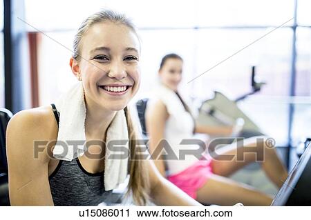 Stock Image - Portrait of young woman smiling. Fotosearch
