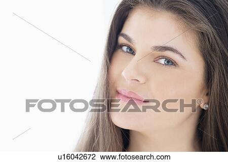 Stock Image - Portrait of young woman with brown hair. Fotosearch