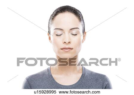 Stock Photography - Portrait of young woman with closed eyes. Fotosearch
