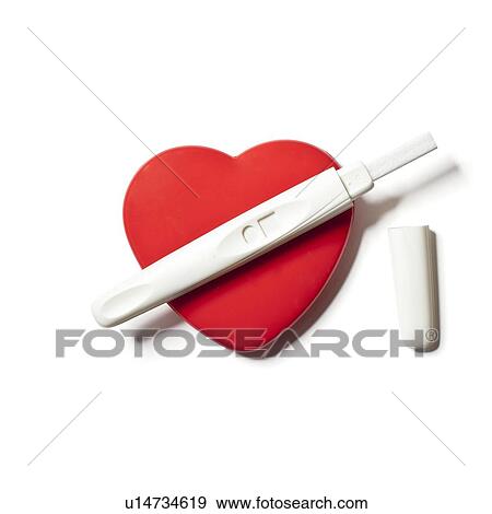 Pregnancy test on red heart View Large Photo Image Stock Photo - Pregnancy test on red heart. Fotosearch