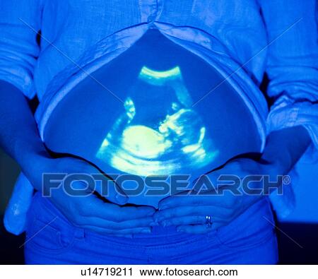 Pregnant woman with baby scan on tummy View Large Photo Image Stock Image - Pregnant woman with baby scan on tummy. Fotosearch
