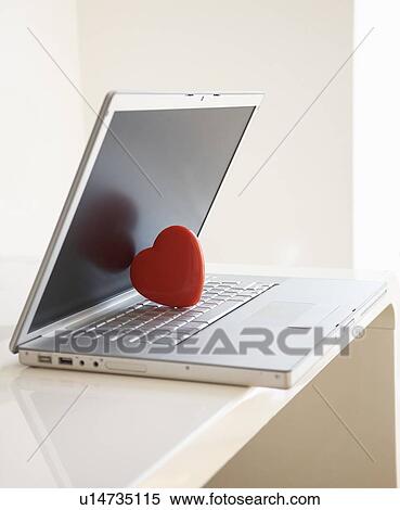 Red heart on laptop computer View Large Photo Image Stock Photography - Red heart on laptop computer. Fotosearch