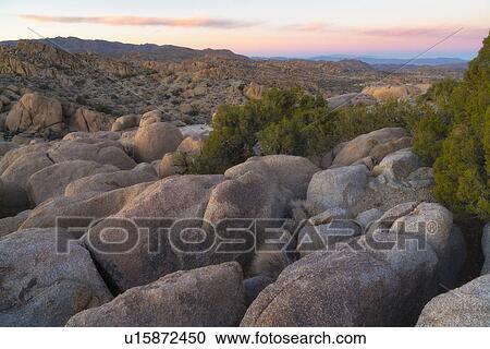 Stock Image - Rocky landscape at sunset. Fotosearch