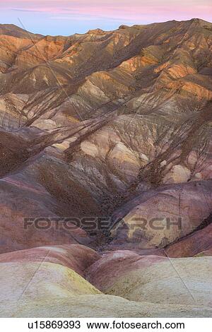 Stock Image - Rocky mountains at sunset. Fotosearch