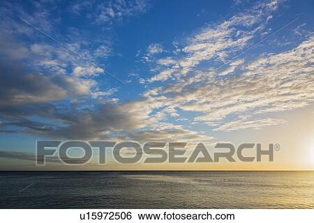 Stock Photograph - Romantic sunset over sea. Fotosearch