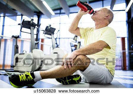 Stock Photo - Senior man drinking water. Fotosearch