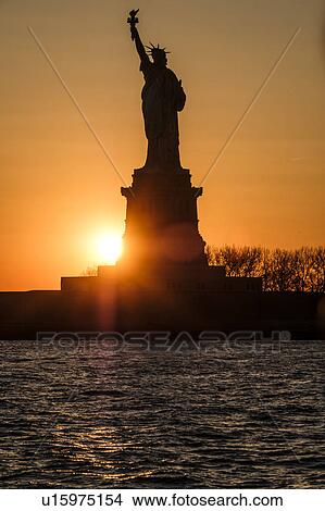 Silhouette of Statue of Liberty at sunset View Large Photo Image Picture - Silhouette of Statue of Liberty at sunset. Fotosearch