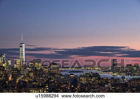Skyline of New York at dusk with One World Trade Center in background View Large Photo Image Picture - Skyline of New York at dusk with One World Trade Center in background. Fotosearch