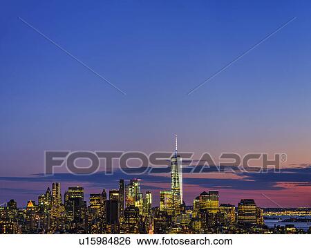 Stock Photograph - Skyline of New York at dusk with view of One World Trade Center. Fotosearch