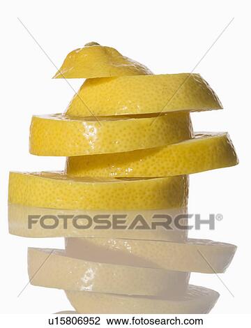Stock Image - Slices of lemon on white background. Fotosearch
