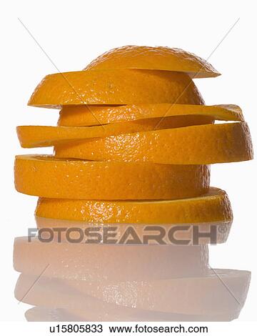 Stock Image - Slices of orange on white background. Fotosearch