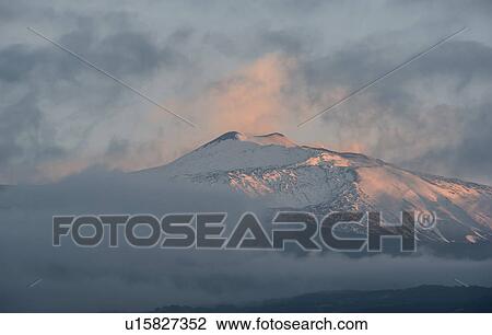 Snowcapped mountain at sunset View Large Photo Image Stock Image - Snowcapped mountain at sunset. Fotosearch