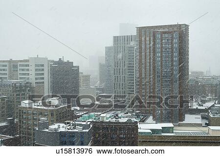 Snowstorm over downtown district View Large Photo Image Stock Photograph - Snowstorm over downtown district. Fotosearch