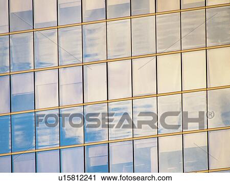 Sunlight reflecting in windows of office building View Large Photo Image Stock Image - Sunlight reflecting in windows of office building. Fotosearch