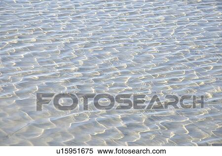 Stock Photography - Sunlight reflecting on tidal pool. Fotosearch