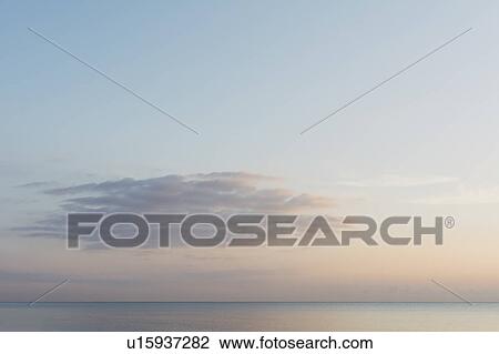 Sunrise sky over ocean View Large Photo Image Stock Image - Sunrise sky over ocean. Fotosearch