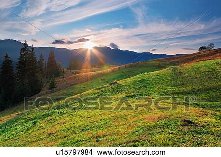 Sunset over mountains View Large Photo Image Picture - Sunset over mountains. Fotosearch