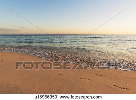 Stock Photo - Sunset over tropical sea. Fotosearch