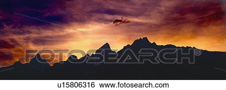 Sunset sky over mountains View Large Photo Image Stock Photograph - Sunset sky over mountains. Fotosearch