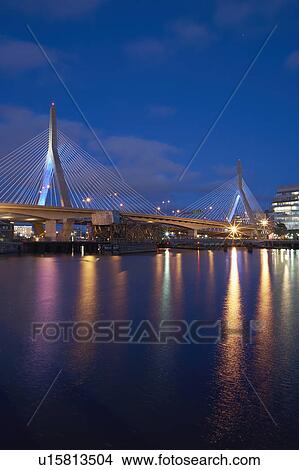 Suspension bridge over river at dusk View Large Photo Image Picture - Suspension bridge over river at dusk. Fotosearch