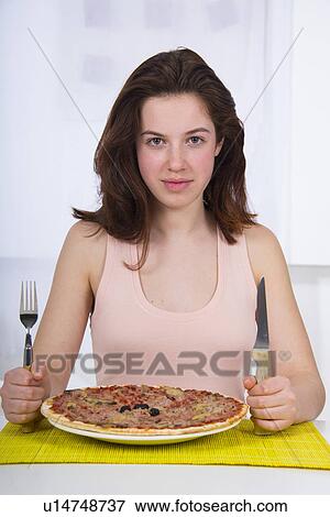 Teenage girl with a plate of pizza View Large Photo Image Stock Photo - Teenage girl with a plate of pizza. Fotosearch
