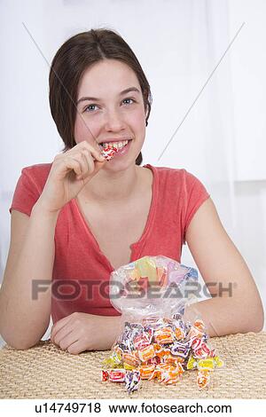 Teenage girl with large bag of sweets View Large Photo Image Stock Photo - Teenage girl with large bag of sweets. Fotosearch