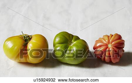 Stock Image - Tomatoes on white background. Fotosearch
