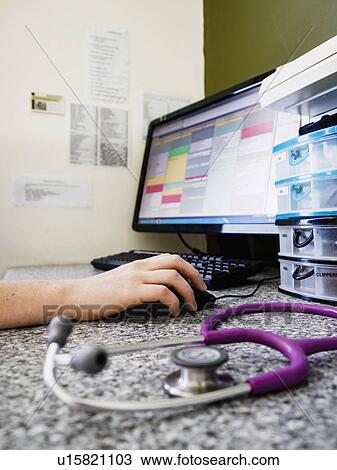 Vet using computer View Large Photo Image Stock Image - Vet using computer. Fotosearch
