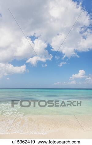 White clouds over tropical sea View Large Photo Image Stock Photo - White clouds over tropical sea. Fotosearch