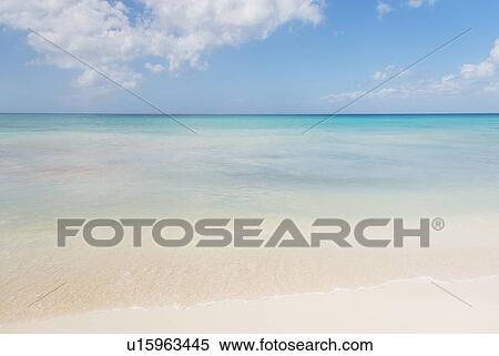 Stock Photography - White clouds over tropical sea. Fotosearch