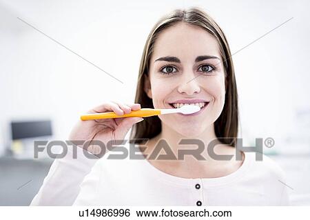 Woman brushing teeth View Large Photo Image Stock Photograph - Woman brushing teeth. Fotosearch