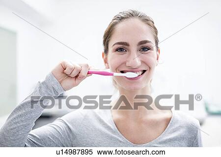 Woman brushing teeth View Large Photo Image Stock Photography - Woman brushing teeth. Fotosearch