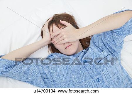 Picture - Woman covering eyes. Fotosearch
