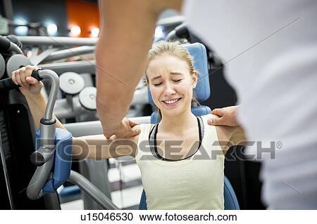 Woman in pain while doing exercise View Large Photo Image Stock Image - Woman in pain while doing exercise. Fotosearch